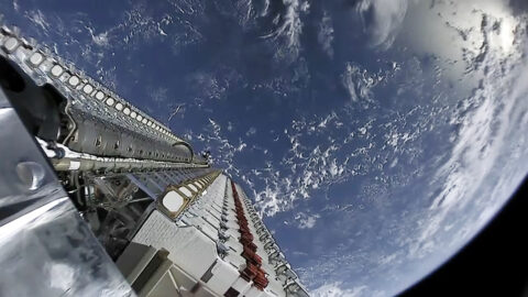 Starlink satellites deploying above Earth