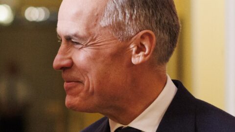 Mark Carney wearing a Canada flag pin