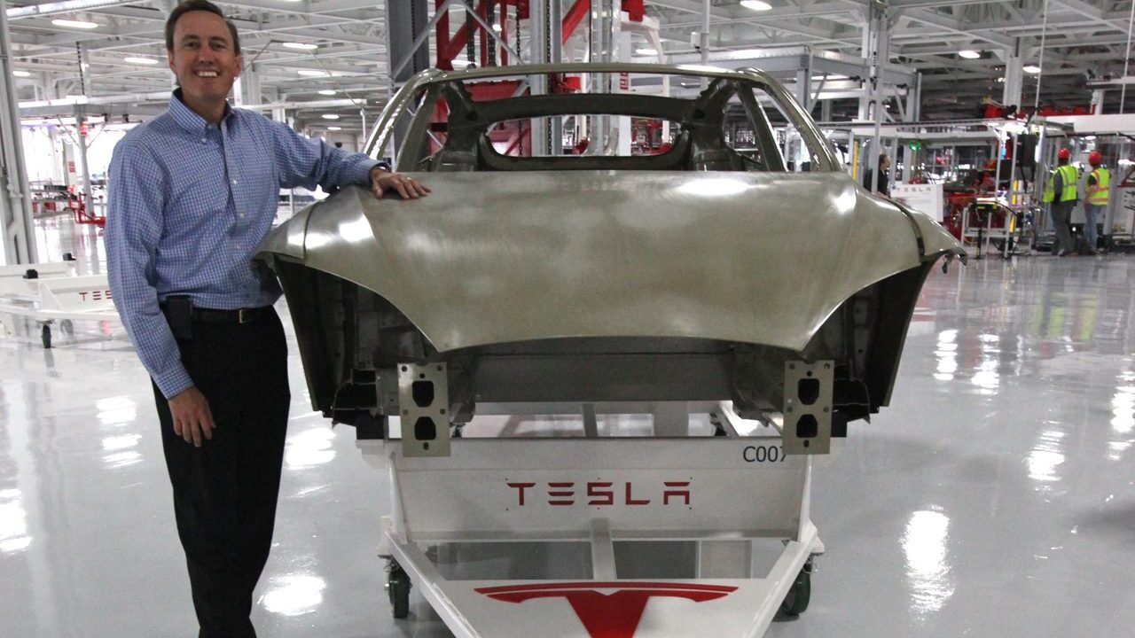 A Tesla vehicle body on a factory floor