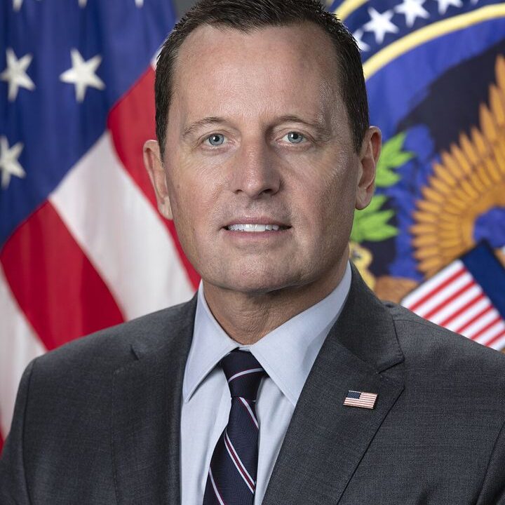 Official portrait of Ric Grenell in a suit